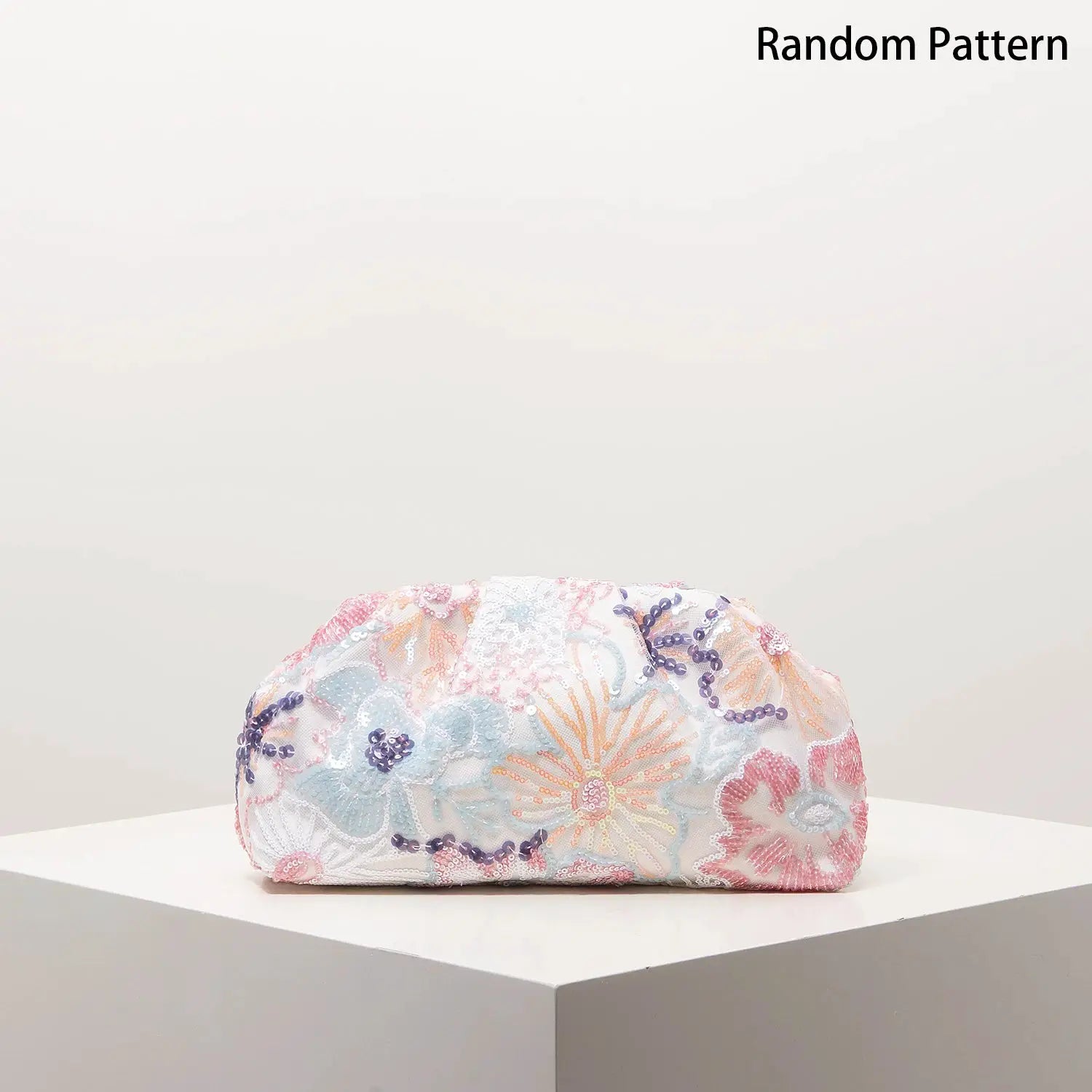 Clutch bag with pastel floral sequin embroidery on white fabric