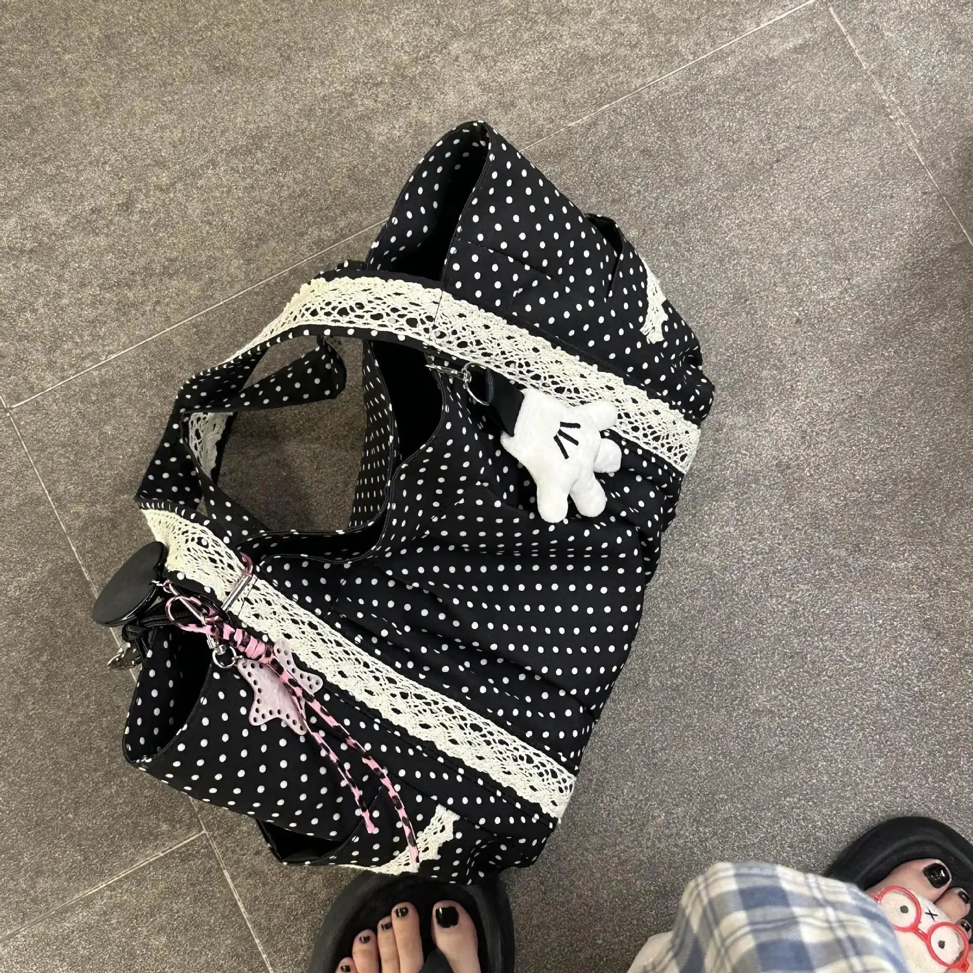 Korean vintage canvas shoulder bag in black with white polka dots, cream lace trim, and multi-pocket design.