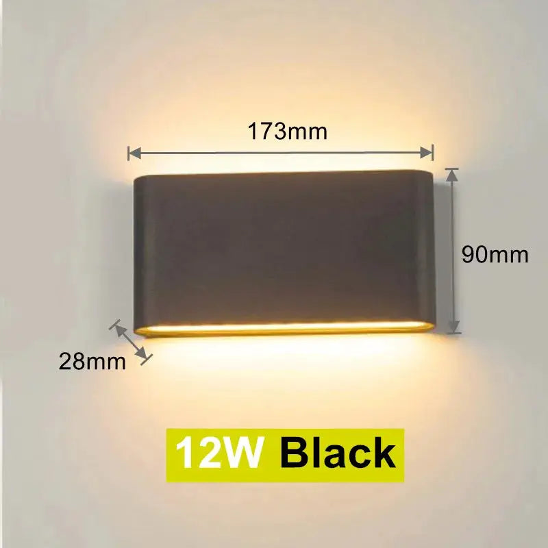 LED wall lamp, black 12W; 173mm wide by 90mm high with 28mm depth, warm bottom glow