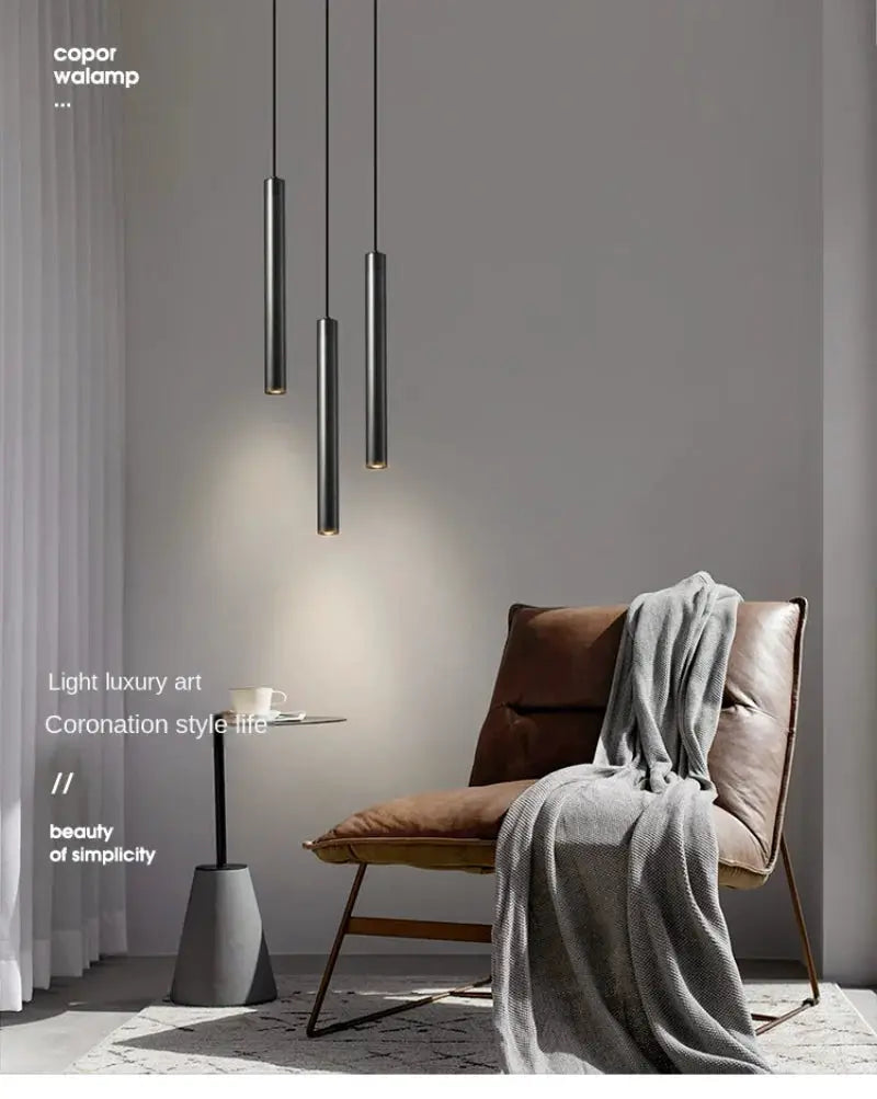 Minimalist black metal bedside pendant lamps, a 3-pendant set with warm LED glow over a cozy seating area