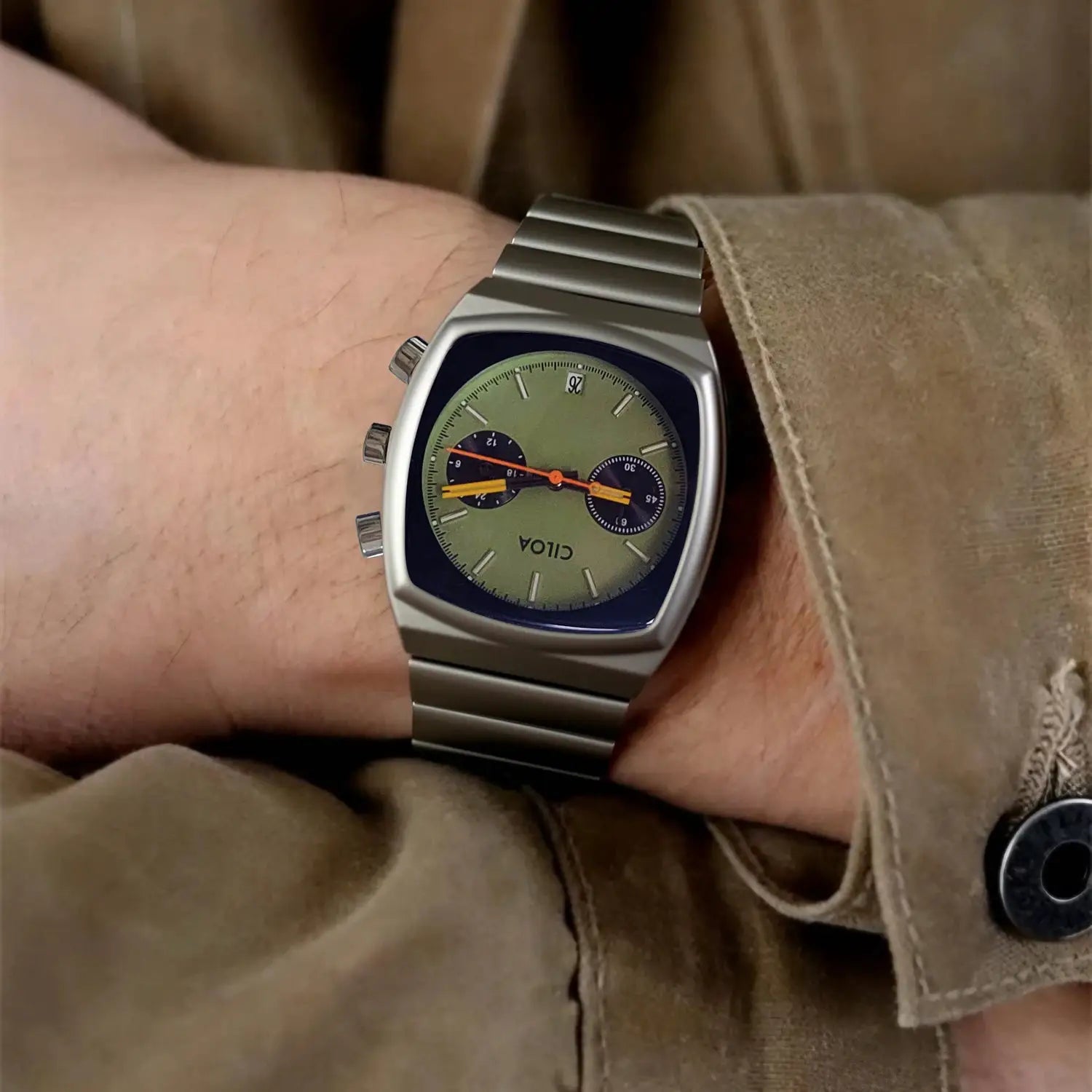 CILOA men's premium stainless steel quartz watch on wrist; green dial with orange hands.
