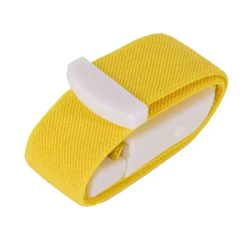 Yellow fabric tourniquet with a white plastic buckle for emergency medical first aid.