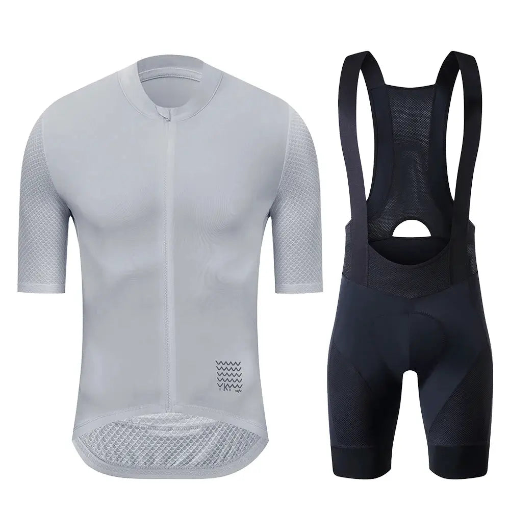 Cycling jersey set with light gray zippered short-sleeve jersey and black bib shorts with mesh panels