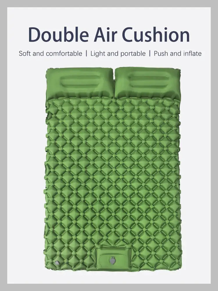 Double inflatable camping mattress in green with two head pillows and diamond-quilted surface; extra-wide sleeping pad.