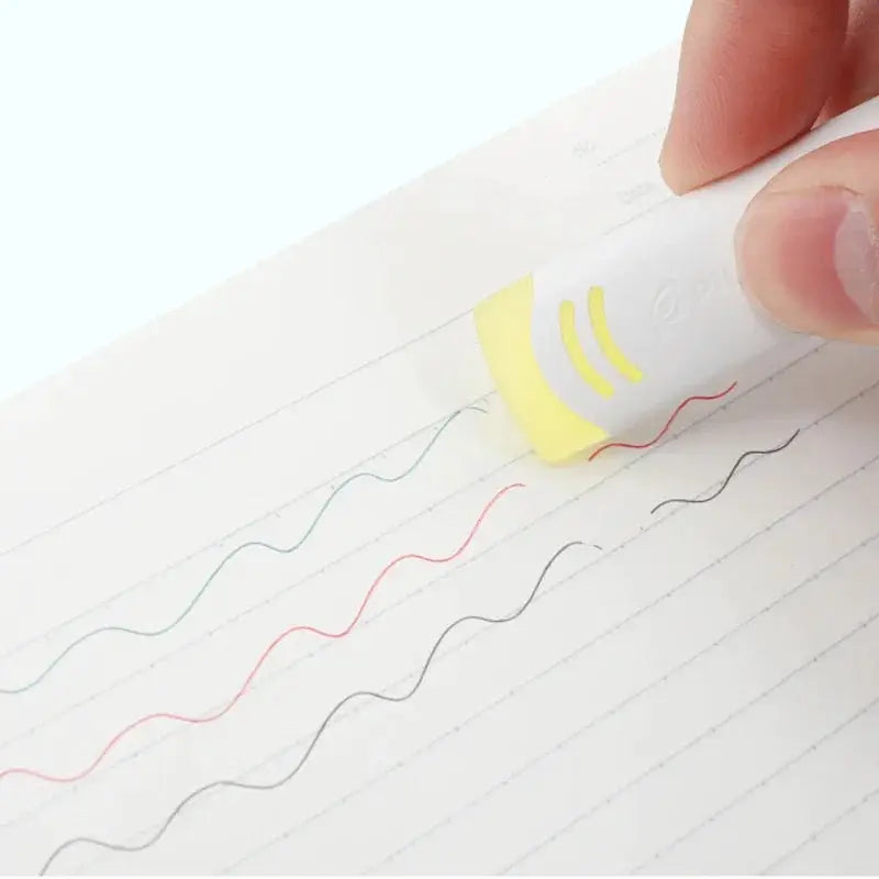 Pilot friction erasable pen eraser EFR-6 in white with yellow end erasing colored lines on ruled notebook