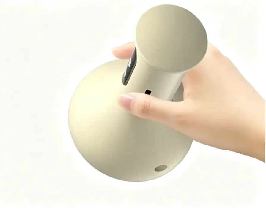 USB Rechargeable Abdominal Massager by Simples Market, beige handheld device with round massage head