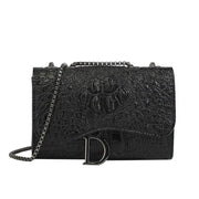 Women's black croc-embossed leather crossbody bag with chain strap and silver D clasp by Simples Market