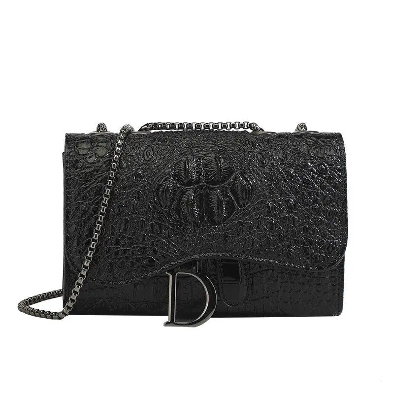 Women's black croc-embossed leather crossbody bag with chain strap and silver D clasp by Simples Market
