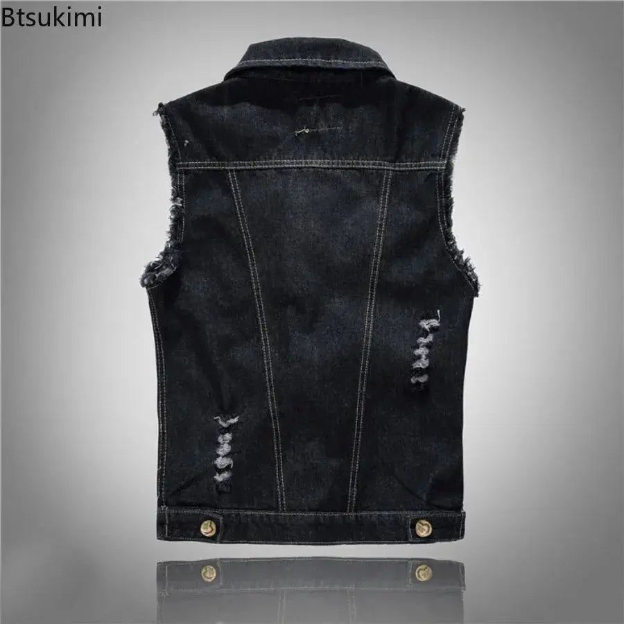 Men's denim sleeveless vest in black indigo wash with distressed patches and frayed armholes, back view