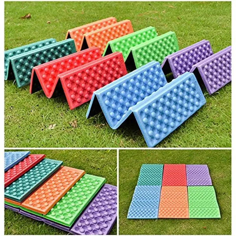 Colorful camping foam pads set on grass; foldable wedge seats in blue, red, green, orange, purple (9 pads)
