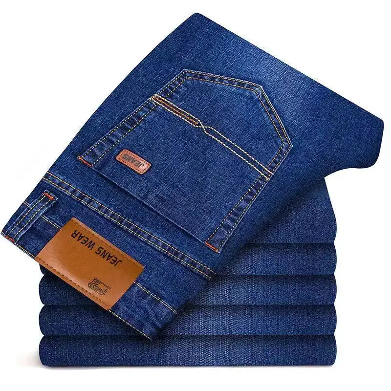 Men's straight denim jeans, dark blue stretch fabric with back pocket and brown leather patch.