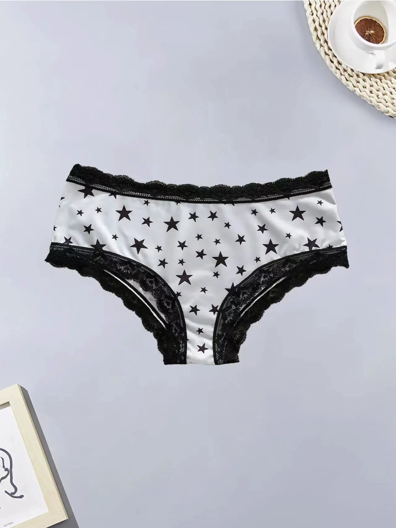 Women's white star-print panties with black lace trim