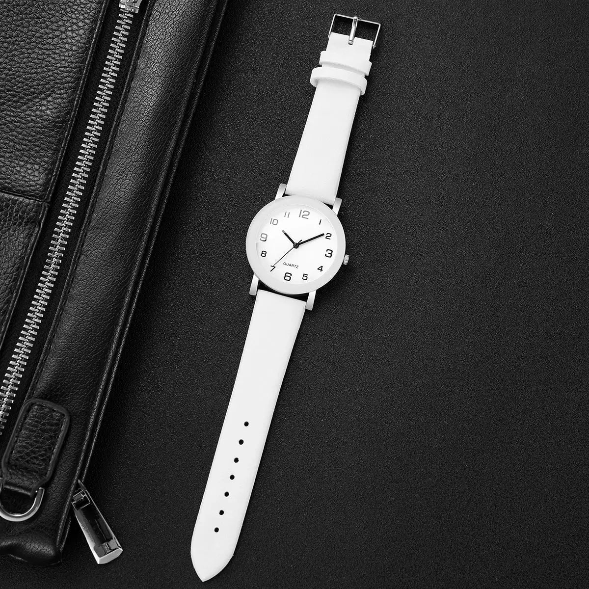 Wristwatch by Simples Market with white leather strap, white dial, silver case, Arabic numerals