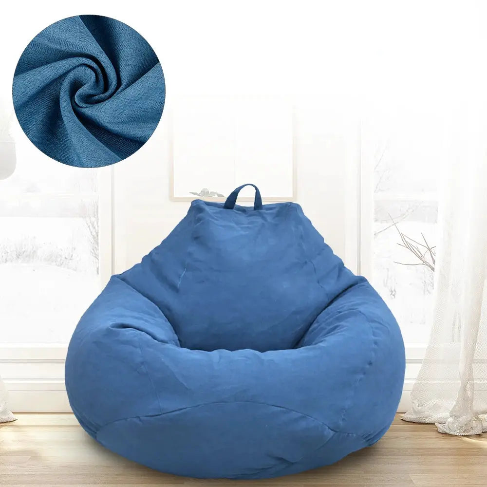 Simples Market blue bean bag chair with handle and textured fabric cover in a bright living room.