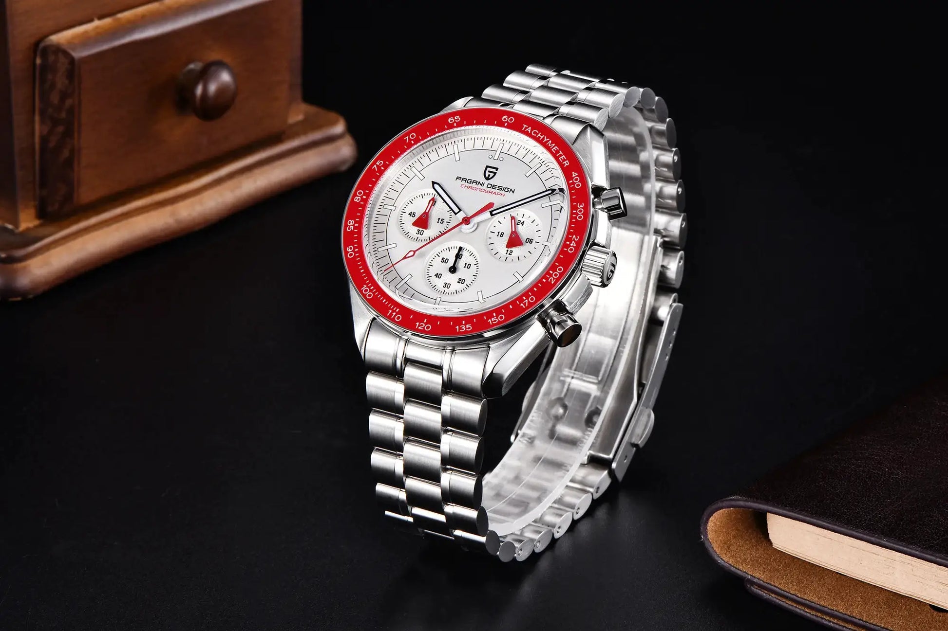 Pagani Design 500 Speedometer chronograph watch with steel bracelet, red tachymeter bezel, white dial and leather strap.