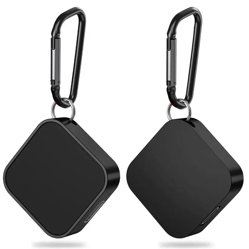 Portable wireless Apple Watch charger by Simples Market, black square cube with carabiner clips, two units.