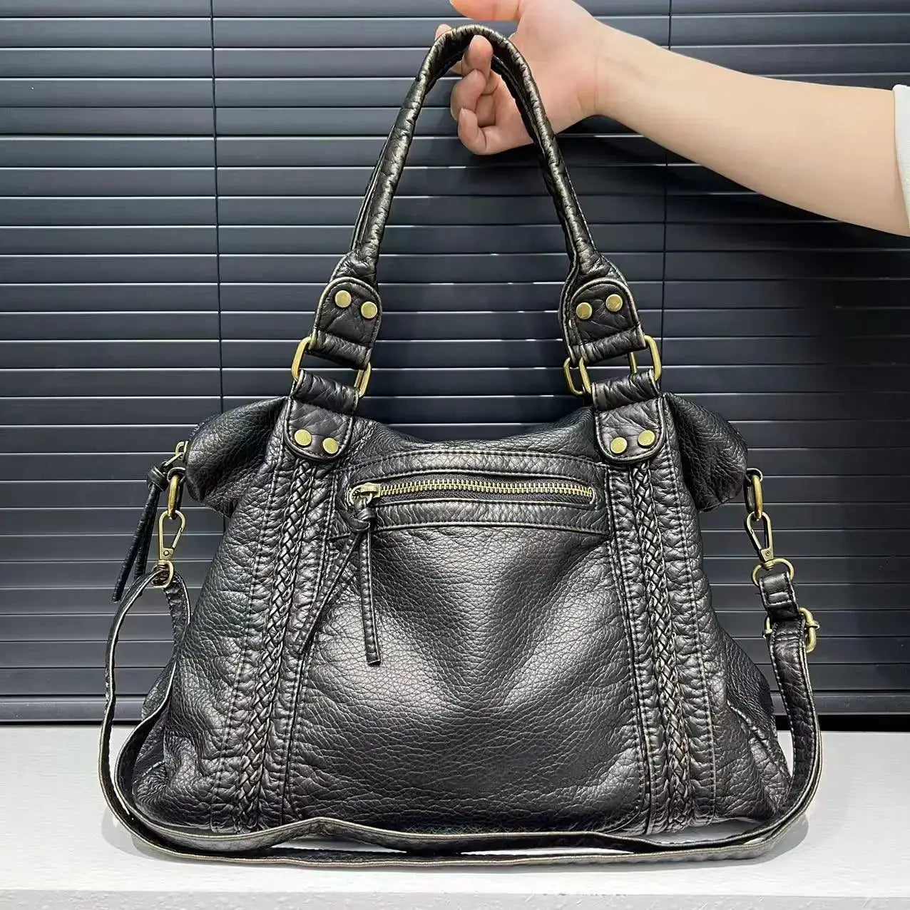 Simples Market Y2K Spicy Girl one-shoulder crossbody bag, black washed leather with gold hardware and braided edges.