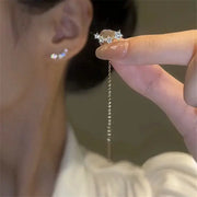 Drop earrings by Simples Market with long wire tassel chain, star and heart bead charms, silver tone