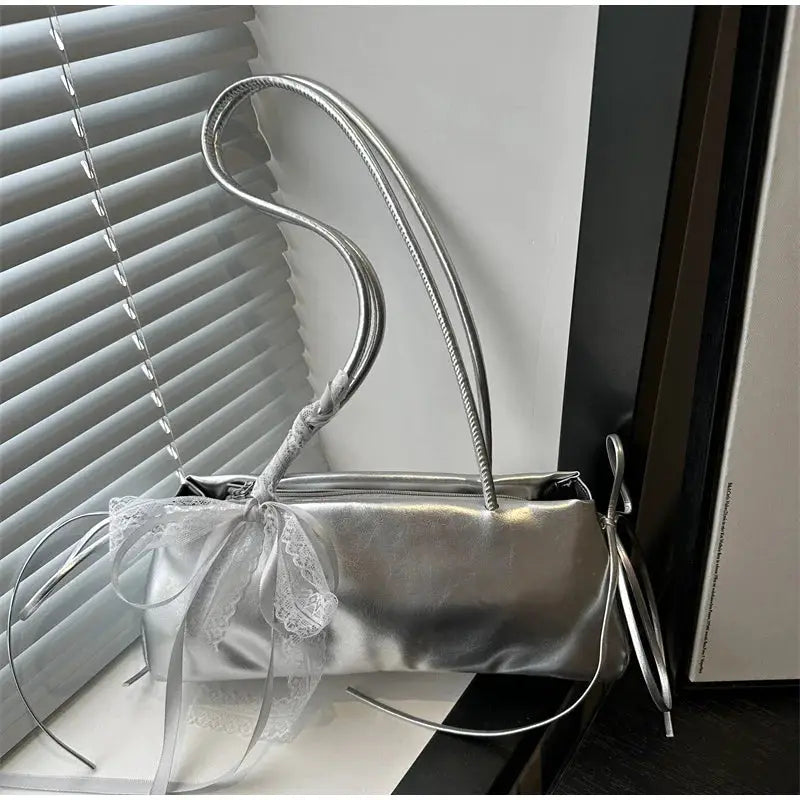 Square silver PU bag with lace bow and shoulder strap by Simples Market