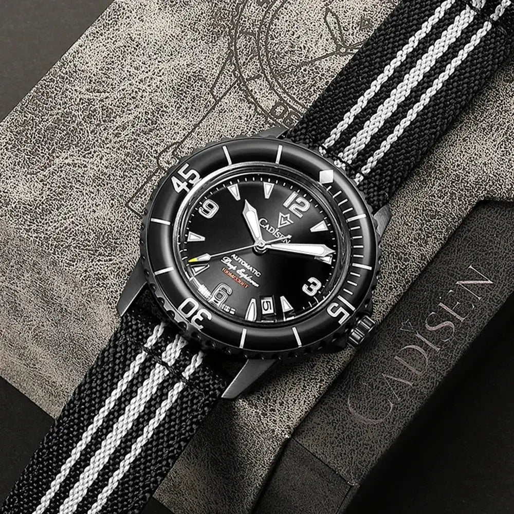 CADISEN Deep Explorer 2025 watch with black dial, black case, luminous hands, and black and white striped canvas strap