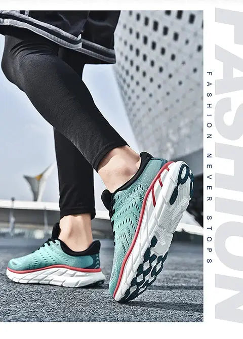 Men's running shoes; teal knit upper with cushioned white sole and red accents.
