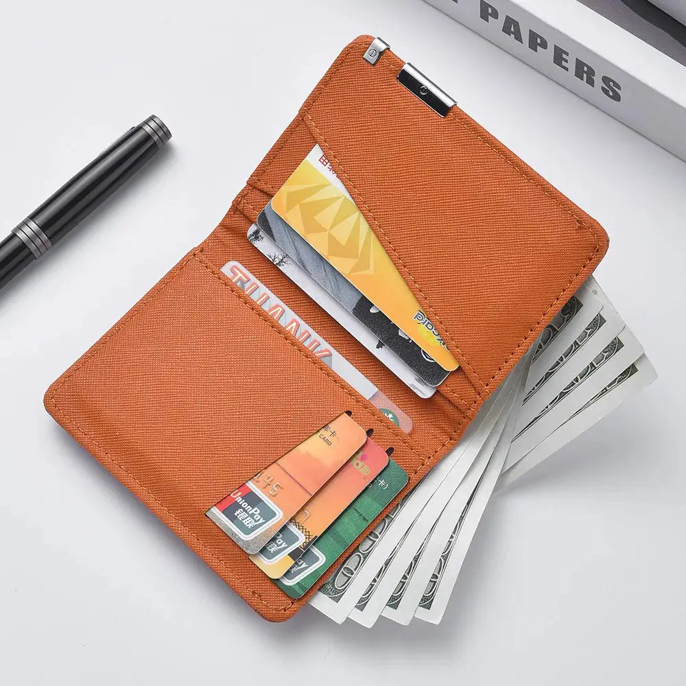 Small slim wallet in orange faux leather with multiple card slots and cash