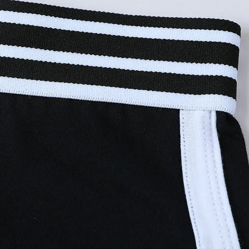 Women's low-waist boxer shorts in black with a white striped waistband, breathable sport underwear