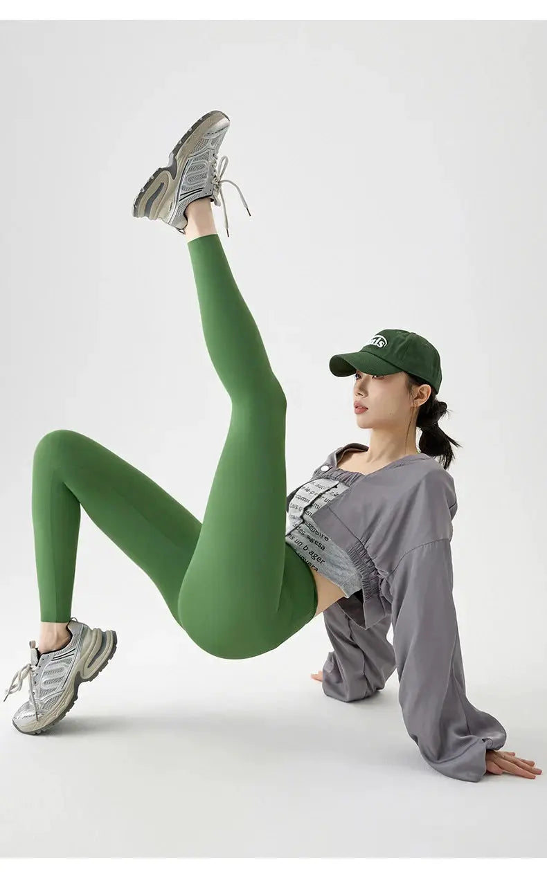 Leggings green seamless sharkskin athletic tights for women, worn with sneakers
