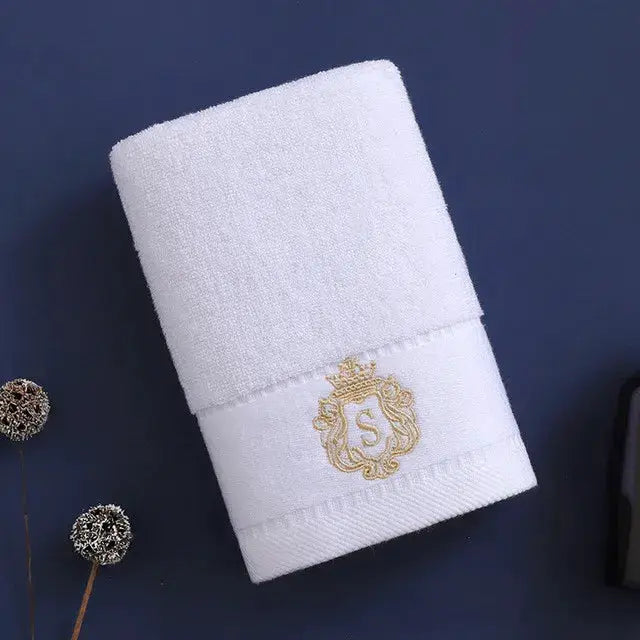 Cotton towel by Simples Market, white with gold crest embroidery on the band