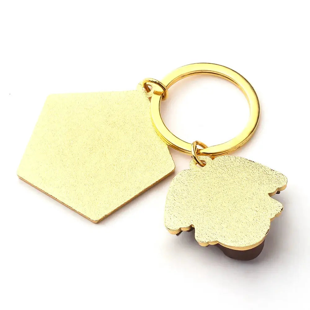 Chocolate Frog keychain with gold-tone hexagon tag and frog charm, two charms.