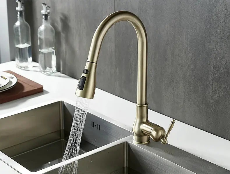 Kitchen faucet with pull-out sprayer in antique bronze finish over double-basin sink by Simples Market