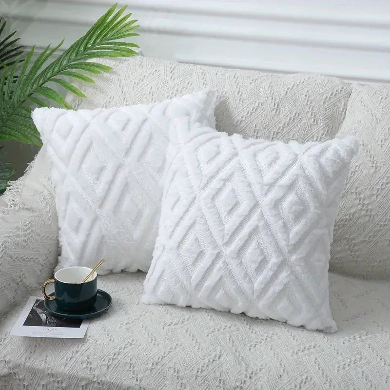 Two white rhombus jacquard plush throw pillow covers on a textured sofa, Nordic style decor