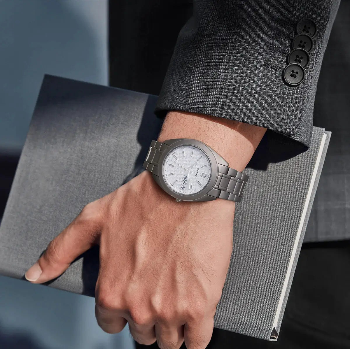 BERNY titanium men's watch with silver dial, date window, and grey metal bracelet