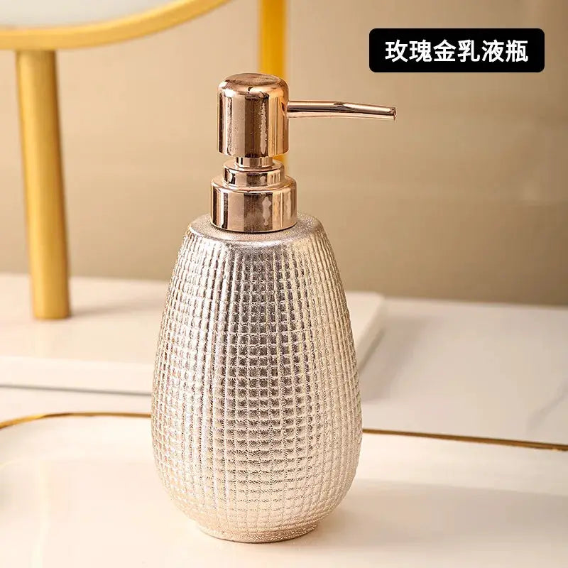 Rose gold ceramic soap dispenser by Simples Market for bathroom accessories set