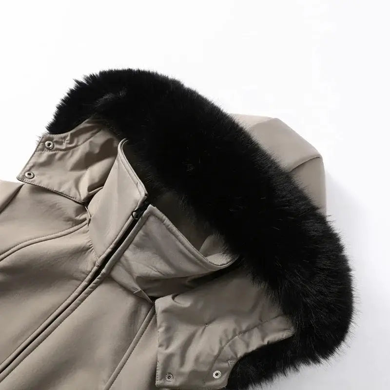 Taupe hooded puffer ski coat with black faux-fur trim on the hood.