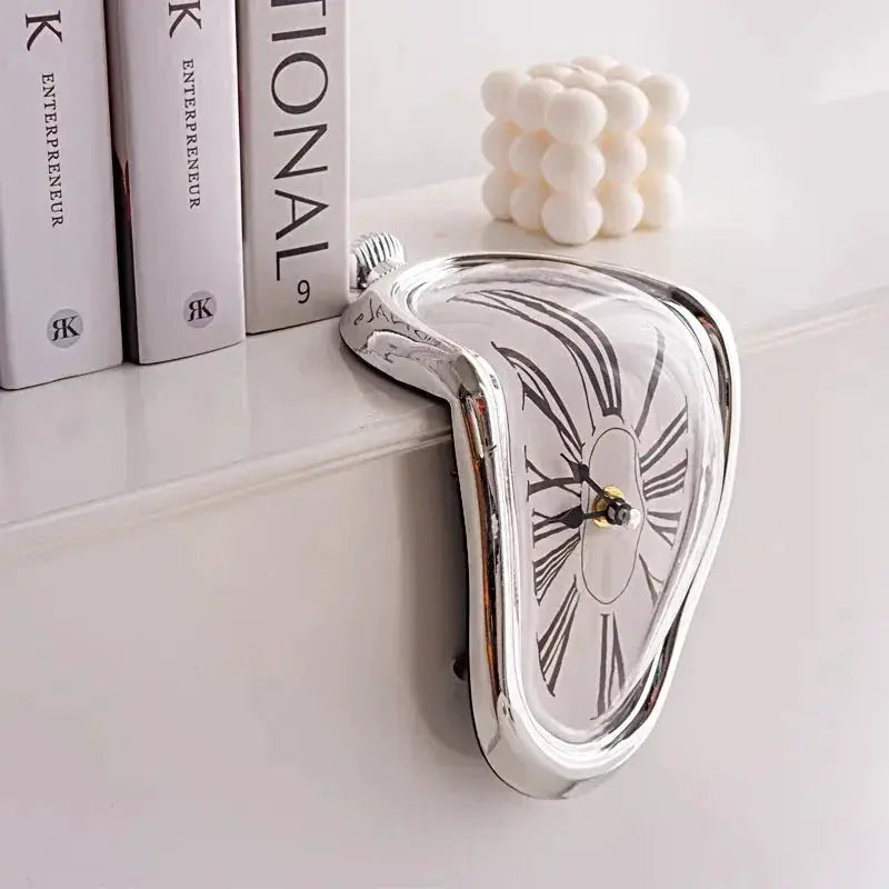 Surreal Melting Clock by Simples Market; chrome finish Salvador Dalí style wall clock for home or office decor