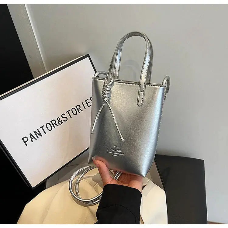 PU leather mini crossbody bag in metallic silver with top handles and knotted strap, Simples Market