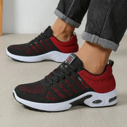 Pair of men's breathable lace-up running shoes by Simples Market, black and red knit with white sole