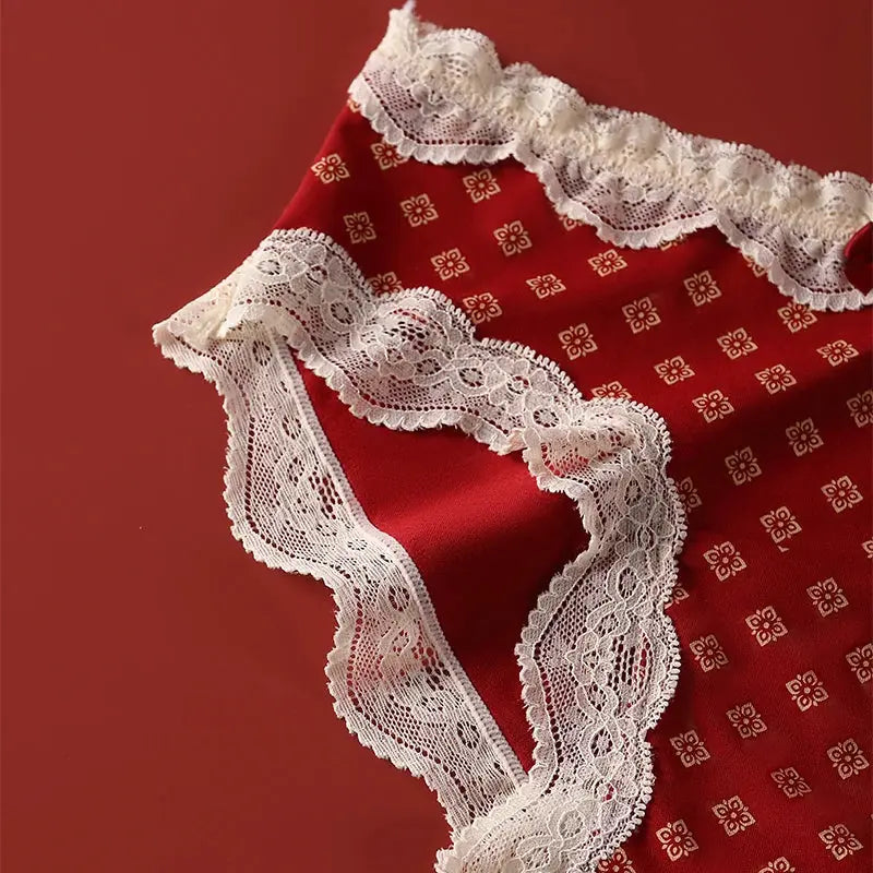 Panties: red fabric with white lace trim and scalloped edges, single piece