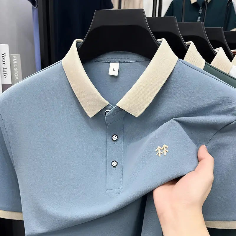 Simples Market silk-cotton polo shirt, light blue with beige collar and cuffs, embroidered chest logo.