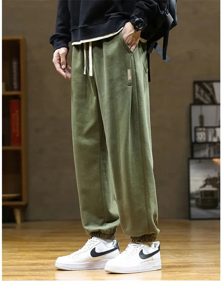 Men's olive green drawstring jogger sweatpants with cuffed ankles, loose fit; plus size 8XL