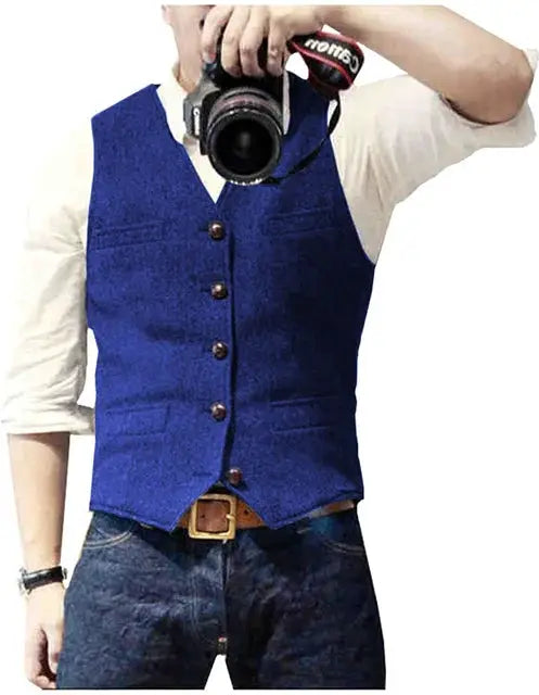 V-neck waistcoat vest by Simples Market in blue with brown buttons, worn over a white shirt.