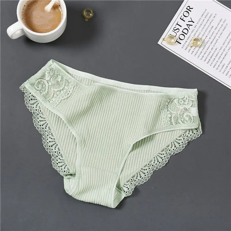 Women's mint green cotton panties with lace-trimmed sides and ribbed texture, low-rise.