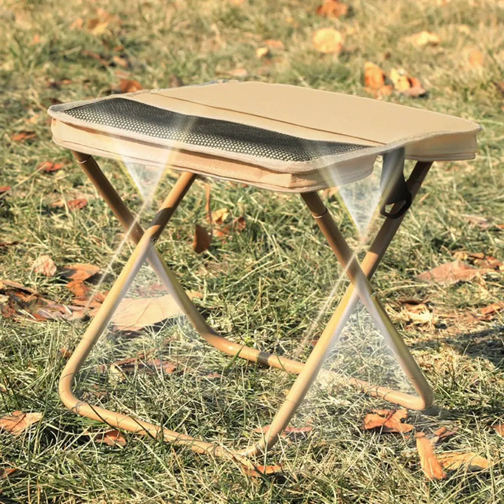 Simples Market folding outdoor stool; beige fabric seat with metal X-frame.