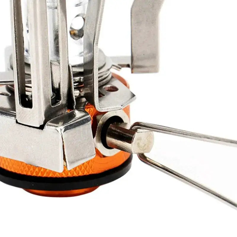 Gas cooker camping stove by Simples Market; portable aluminum alloy ultra-light with orange base and metal supports.