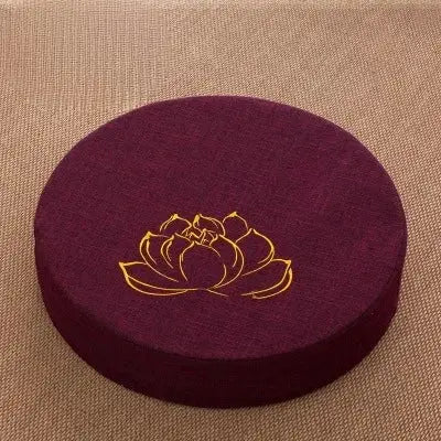 Round maroon linen meditation cushion with gold lotus design by Simples Market