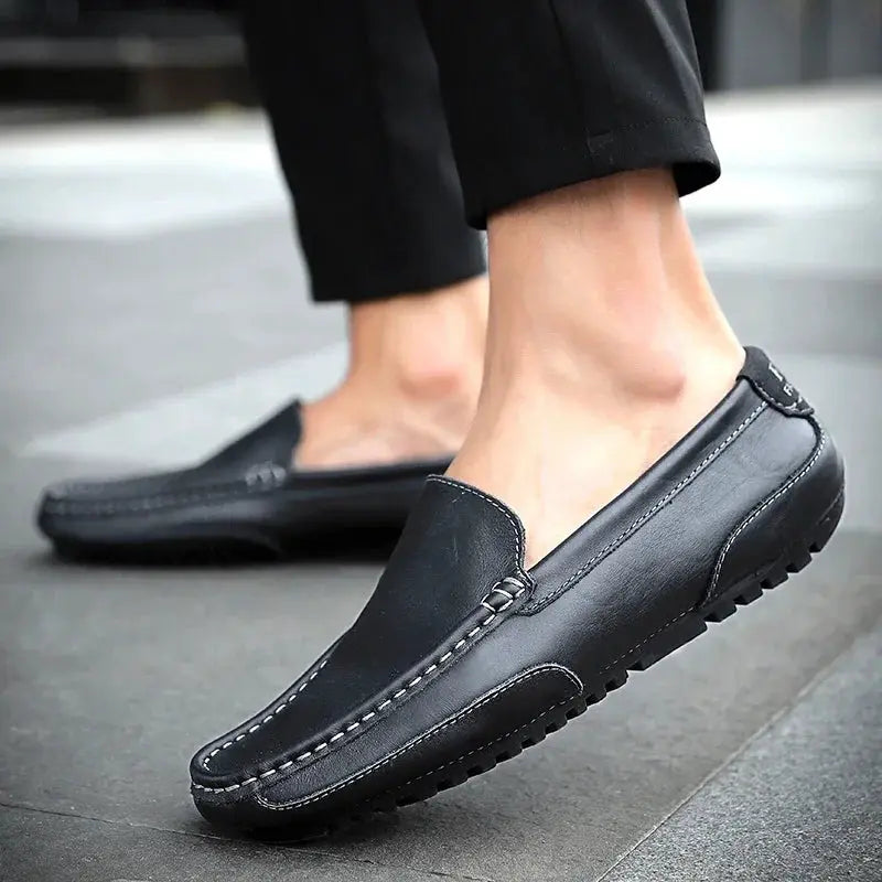 Men's genuine leather loafers by Simples Market, black slip-on moccasin with white contrast stitching and rubber sole.