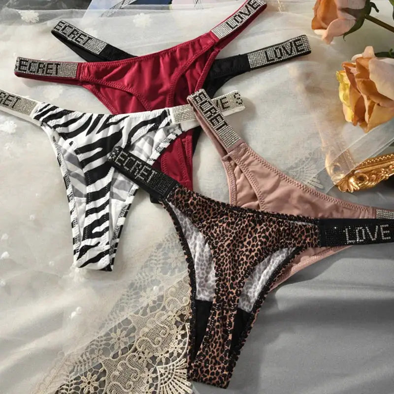 Low waist thong set by Simples Market; 4-piece set zebra, leopard, red and pink with rhinestone LOVE/SECRET bands