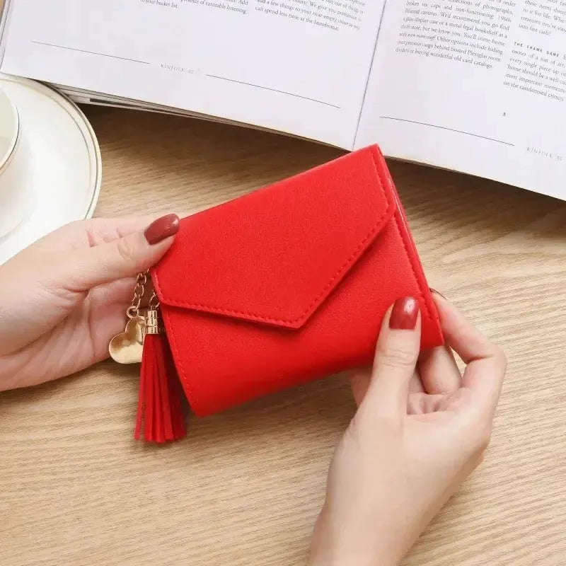 Red PU leather mini wallet for women with tassel and heart charm