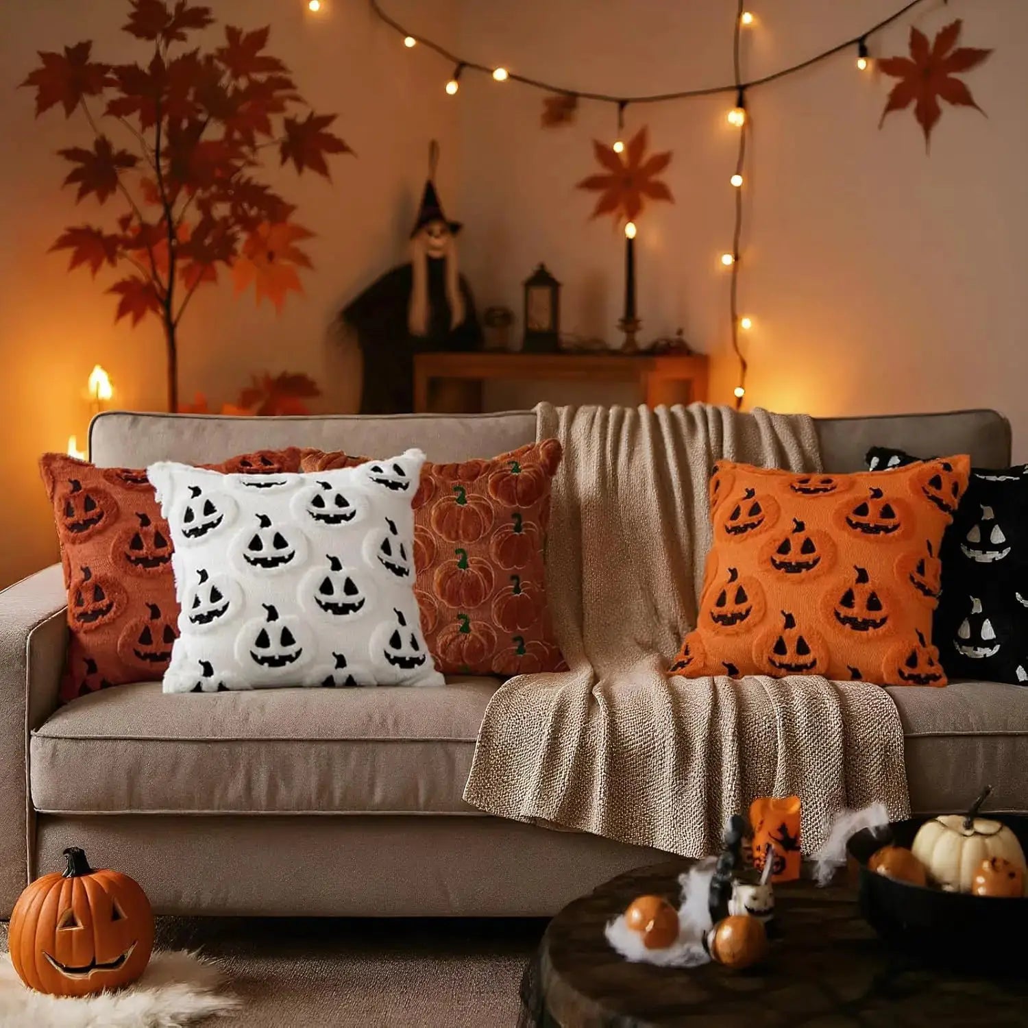 Throw pillow covers 18x18 with white and orange pumpkin pattern on a beige sofa